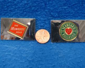 Lot 216. Two sterling silver ingots from "The Great American Railroad Emblems" series. The Milwaukee Road and the Seaboard Air Line. Total weight of 46.2 grams.