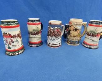 Lot 280. Four Budweiser steins and 1 Coors stein