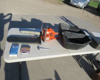Lot 148. Husqvarna 240 chainsaw with 16" bar and extra chains, in a Poulan case