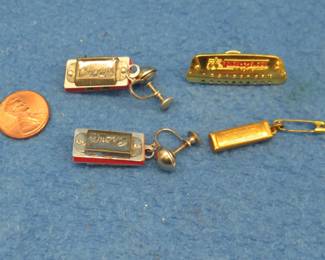 Lot 99. Three teeny-weenie harmonica collectibles: Unknown maker pair of Crown harmonica 1 7/8-inch earrings. Each earring has a 2-holes that sound great. Hohner "Golden Melody"