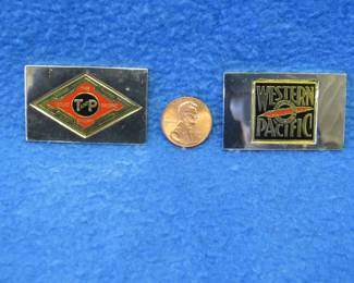 Lot 220. Two sterling silver ingots from "The Great American Railroad Emblems" series. The Western Pacific and the Texas and Pacific. Total weight of 45.8 grams.