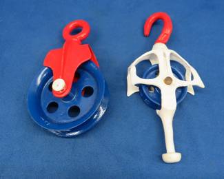 Lot 31. Two old pulleys that have been painted