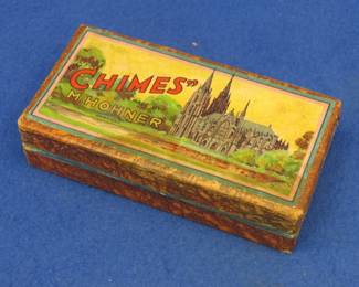 Lot 40. Hohner double-sided tremolo "Chimes" harmonica in a hinged box with very nice graphics. Sounds great. Excellent condition.
