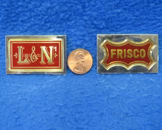 Lot 217. Two sterling silver ingots from "The Great American Railroad Emblems" series. The Frisco and the L & N. Total weight of 46.3 grams.