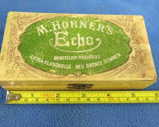 Lot 230. Hohner Up to Date double-sided 40-hole tremolo harmonica in the keys of A and D in a hinged box in good condition. Sounds great. Minimum bid $30.