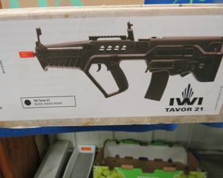 Lot 116. Tavor 21 6mm airsoft gun with accessories. Includes 2 magazines, spinning target, ammo, and original box. Untested.
