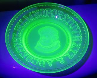 Lot 21. Uranium glass "ABCs" child's plate from Clay's Crystal Works. Excellent condition.