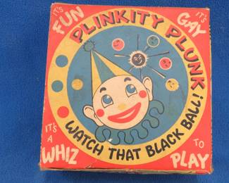 Lot 78. Plinkity Plunk game and a metal top.