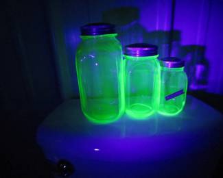 Lot 141. Green Depression uranium glass canister jars and spice jars. All glow under a UV light.