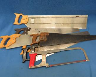 Lot 62. Seven hand saws including one hack saw and a large miter box saw