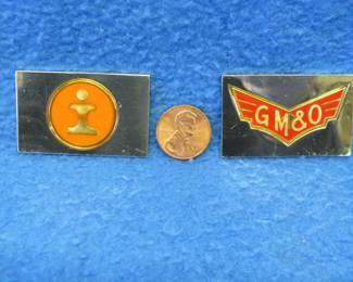 Lot 221. Two sterling silver ingots from "The Great American Railroad Emblems" series. The Illinois Central Gulf and the GM&O. Total weight of 46.7 grams.