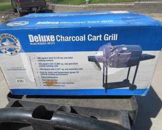Lot 138. Deluxe charcoal grill cart. New in the box.