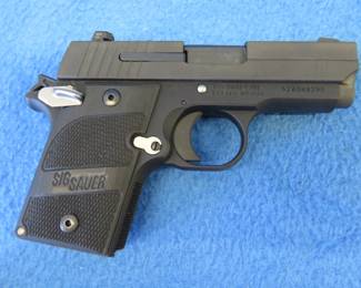 Lot 17. Sig Sauer P938 semi-auto 9mm pistol. S/N S2A048290. Includes one magazine, manual, gun lock, Sig lubricant, and case.