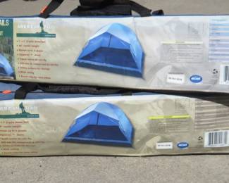 Lot 137. Two 7' x 7' 2-pole dome tents. Appear to be new in the box.