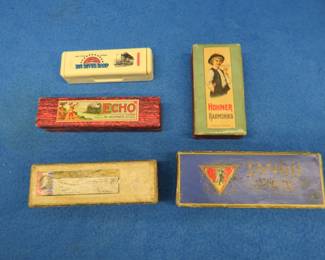 Lot 93. Five vintage empty harmonica boxes: Hohner Tango 6" box in VGC. Hohner unidentified 5 1/2" box. Hohner unidentified 4 1/2" box. Hohner The Echo 5 3/4" box. Hohner 4