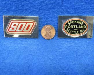 Lot 222. Two sterling silver ingots from "The Great American Railroad Emblems" series. The Soo Line and the Spokane Portland and Seattle. Total weight of 47.4 grams.