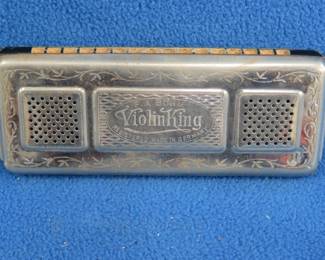 Lot 239. F.A. Bohm Violin King double-sided 64-reed tremolo concert harmonica in the keys of C and G in the tin box in excellent condition. Sounds great. Minimum bid $20.