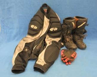Lot 76. Motocross riding gear: Joe Rocket coat. Marked size XL which we believe is a child's or women's size. O'Neal MX boots. Size 6. Small size Fox gloves.
