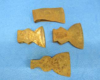 Lot 130. Four single bit axe heads