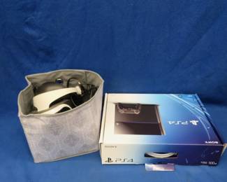 Lot 86. PS4 with a Sony VR headset and associated cables, untested.