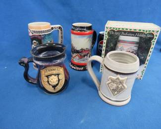 Lot 266. Three beer steins and two Renaissance Festival mugs