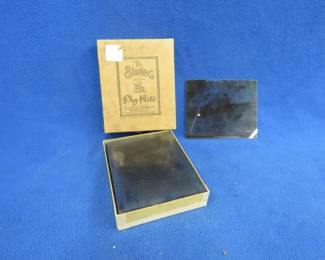 Lot 276. A box of glass negatives