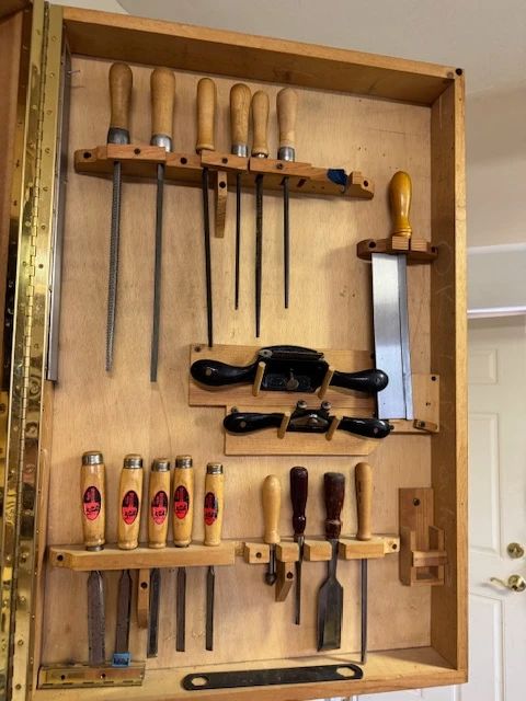 Fine Quality Wall - mounted Woodworking hand tool Cabinet featuring varoius files, Chisels and small saw 