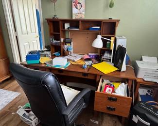 A messy Desk and office supplies