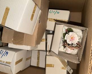 Porcelain flowers, all new in boxes!