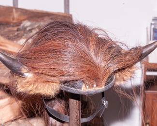Helmet with horns and braided ponytail 