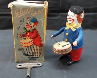 Vtg. Schuco Solisto Clown Drummer wind-up toy in its original box, complete with a metal key. The toy was produced by Schuco in Germany, likely during the 1930s to 1950s. Toy is functional