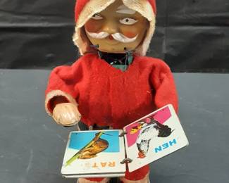 Vtg. Japanese mechanical wind-up Santa Claus toys, often made by the Alps company. Still functional and flips pages to children's book on animals and lifts head with each page turn