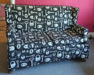 Black and White Key Patterned Slipcovered Loveseat