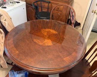 Round dining table with four chairs