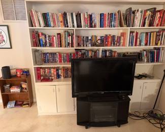 Tv, tv stand, books