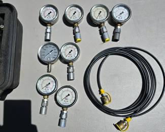 T107 - $220, lot of 8 pressure gauges (30, 60, 100, 160, 1000, and 5000 psi) in a Pelican 1400 Case