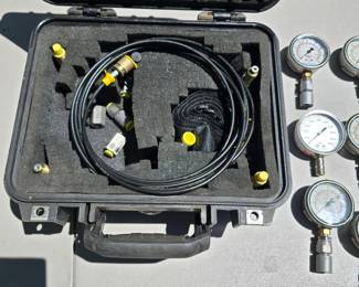 T107 - $220, lot of 8 pressure gauges (30, 60, 100, 160, 1000, and 5000 psi) in a Pelican 1400 Case