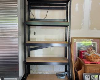 T134 - $40. Metal Garage Shelving Unit with shelves. Measures 36" x 16" x 6' tall.