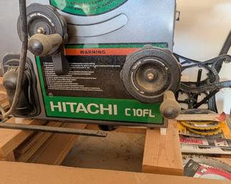 T37 - $225. Hitachi C10FL Table Saw. On a rolling homemade base. 