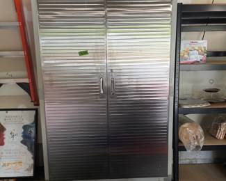 T130 - $225. Seville Classics Rolling Stainless storage cabinet - has been used in the garage. Very good used condition! Measures 48" wide x 24" deep x 77" tall. 