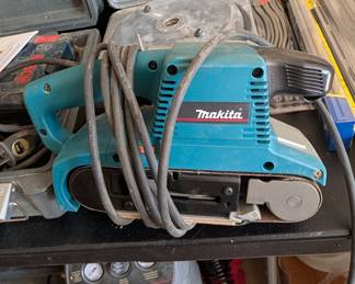 T44 - $200. Makita Model #9903. 3" x 21" Belt Sander. 