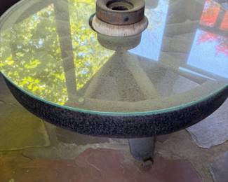 Circular outdoor table table made from a wheel