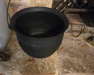 Cast aluminum cauldron.