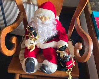 Santa chillin in a rocking chair.