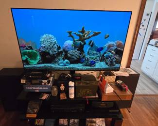 Flat screen TV with remote. And a nice TV stand.