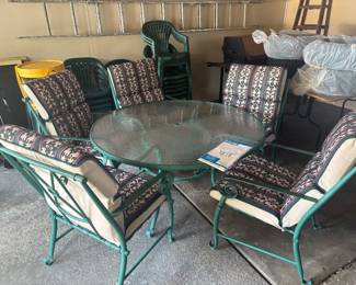 glass metal patio table set with five chairs