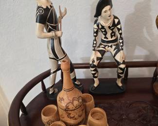 art deco-style figurines and wood decanter with glasses