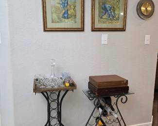 Framed wall art, wine tables, decanter, cutlery and colorful glasses