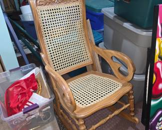 Oak rocking chair with cane back and seat