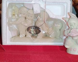 Department 56 Snowbabies figurine set titled "Even a Small Light Shines in the Darkness". Springtime snowbabies